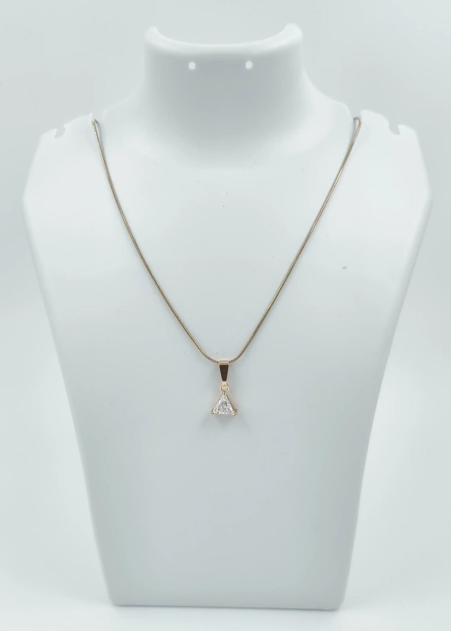 Necklace with a pendant on a mannequin bust against a white background