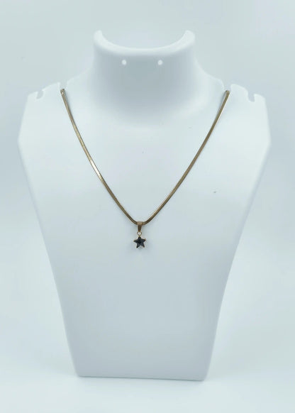 Necklace with a star pendant on a mannequin bust against a white background