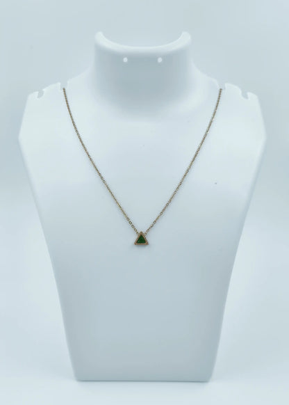 Necklace with a green pendant on a mannequin bust against a white background