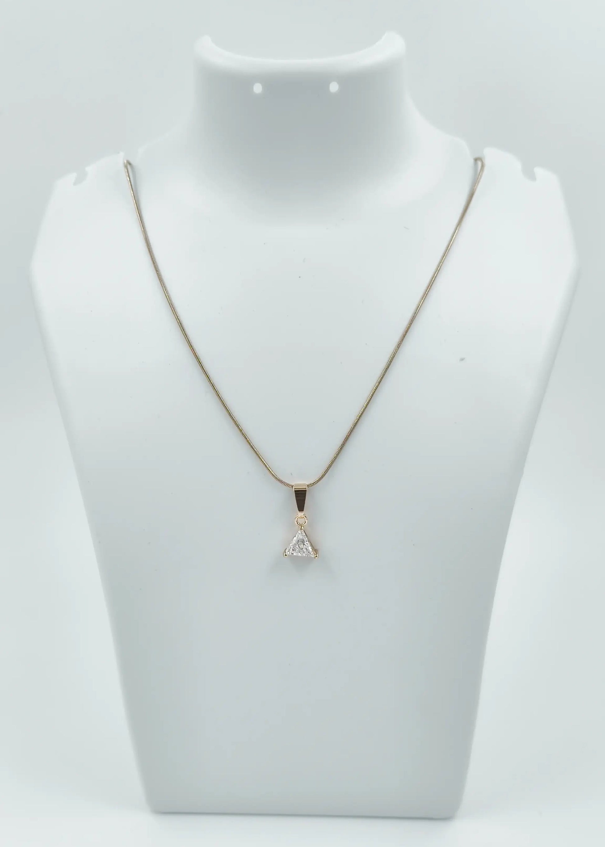 Necklace with a pendant on a mannequin bust against a white background