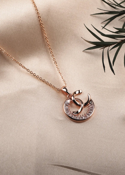 Rose gold necklace with a unique pendant on a beige background