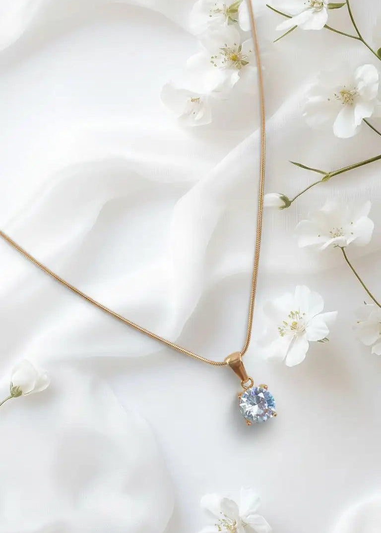 Necklace with a floral pendant on a white fabric background